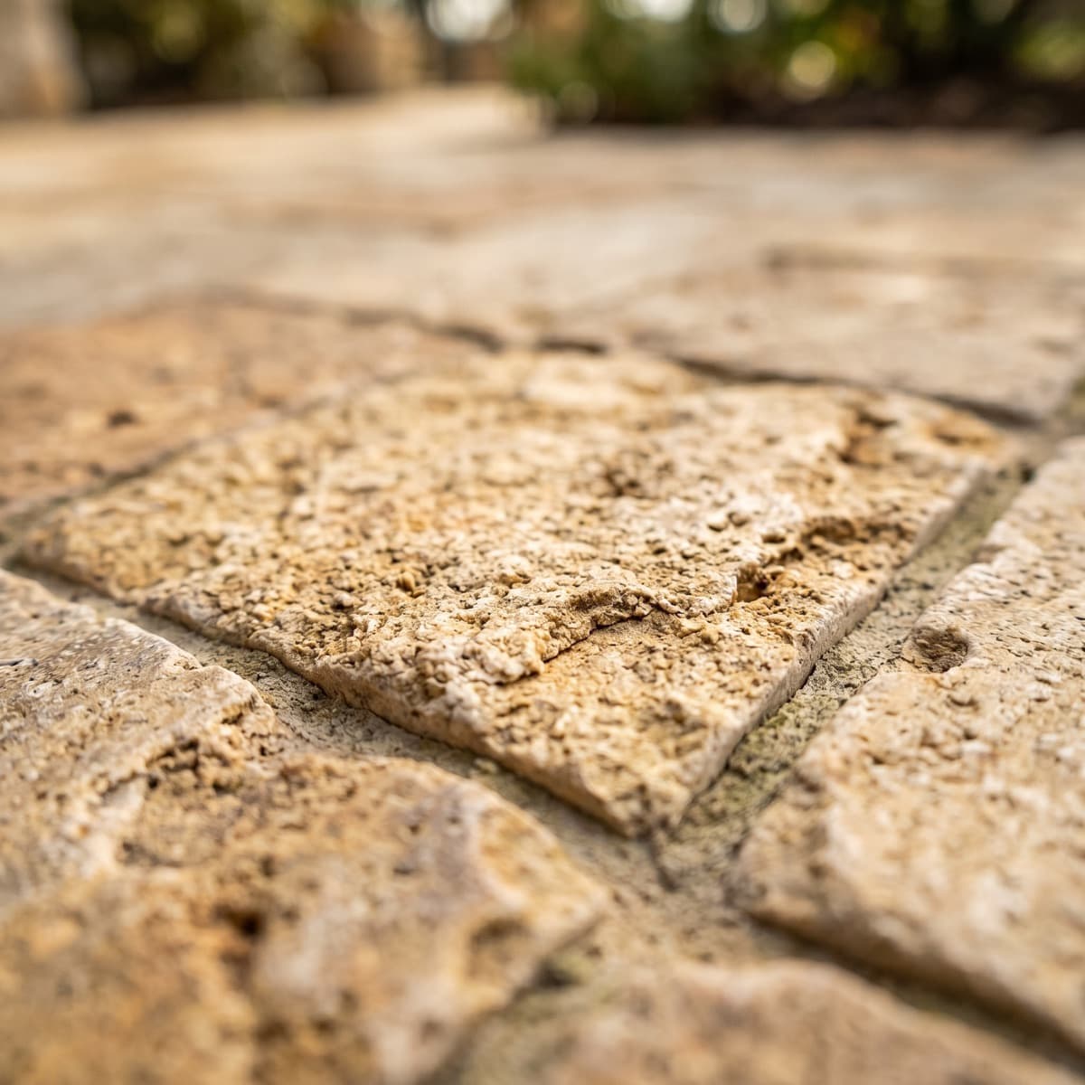 Stone and hardscape texture used as a visual cue for patios, paths, retaining walls, and edging.